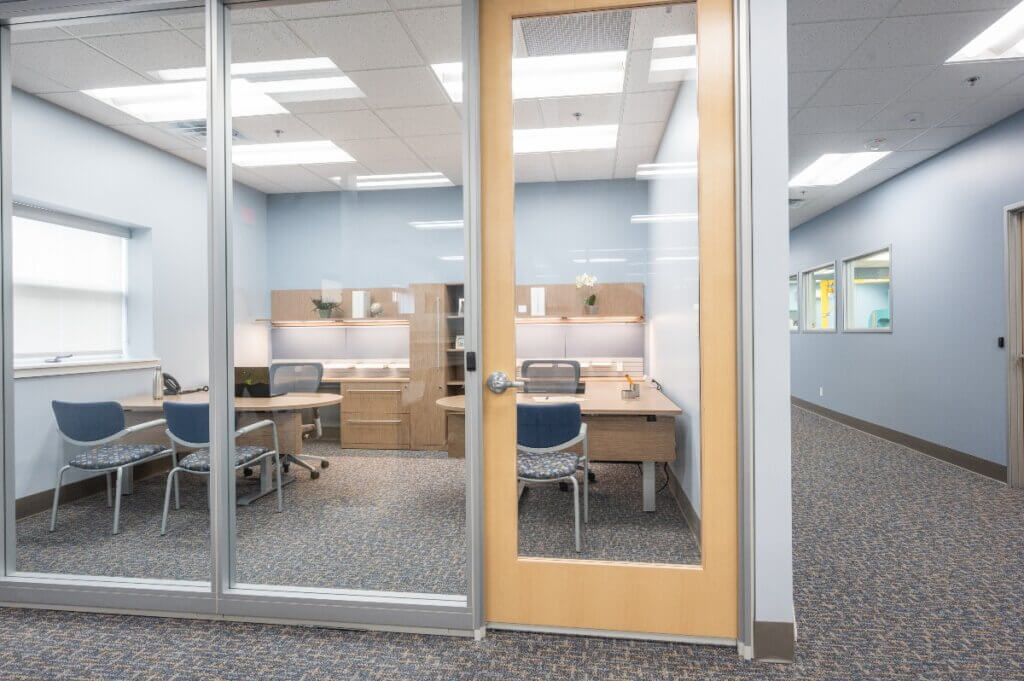 bright office with glass wall panels