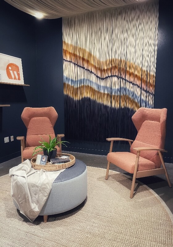 70s inspired office space with macrame wall hanging